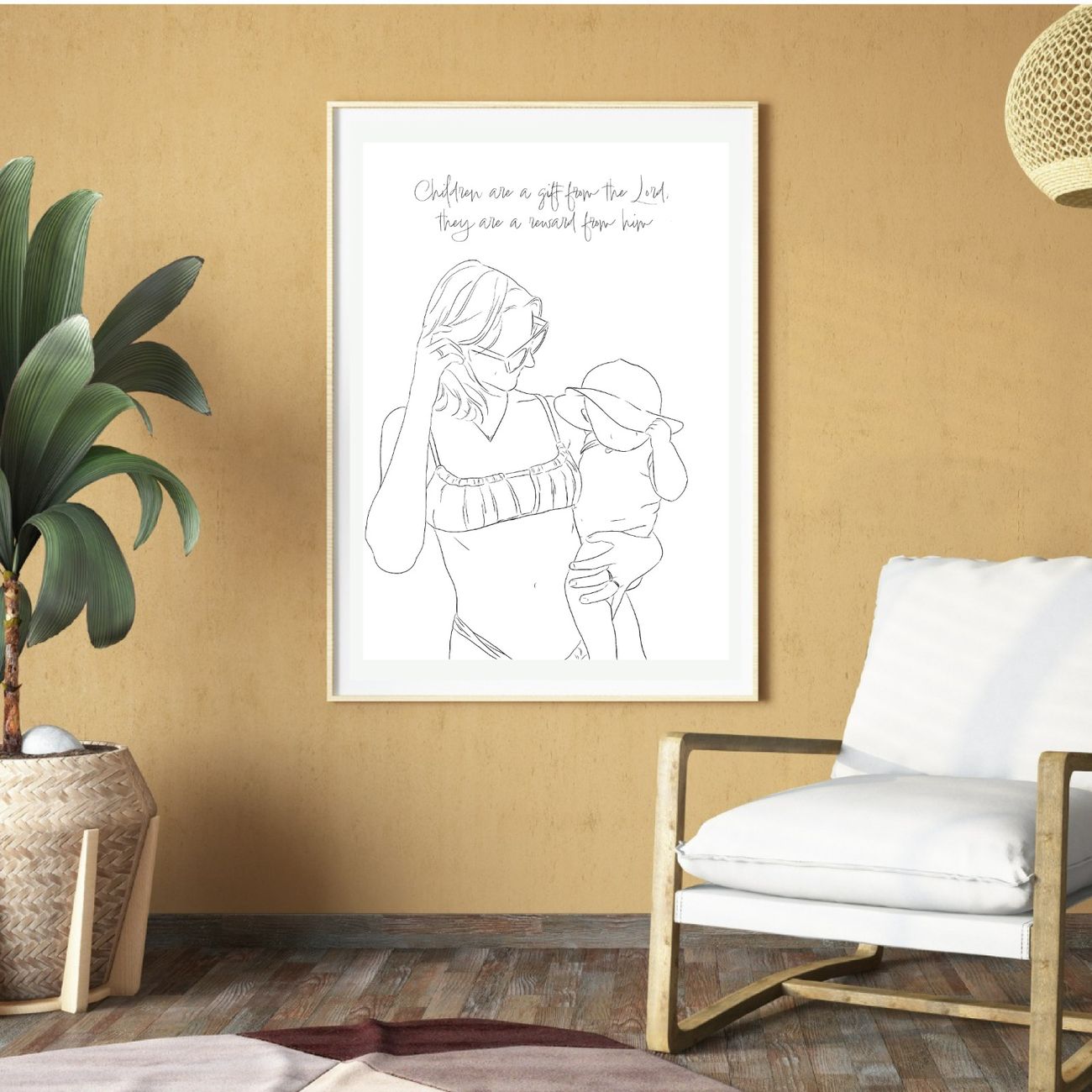 Mother and baby line drawing framed above a lounge chair